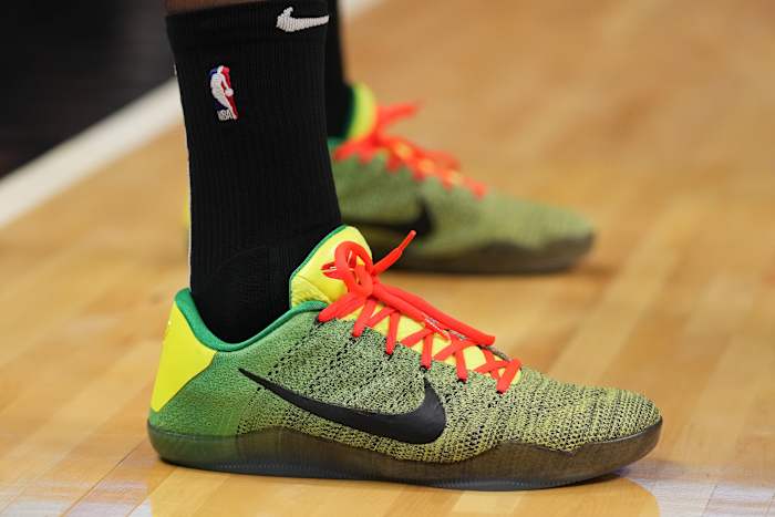 Miami Heat forward P.J. Tucker's green and red Nike Kobe sneakers.